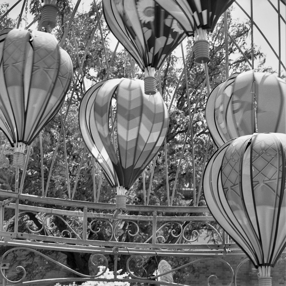 a black and white photo of many hot air balloons