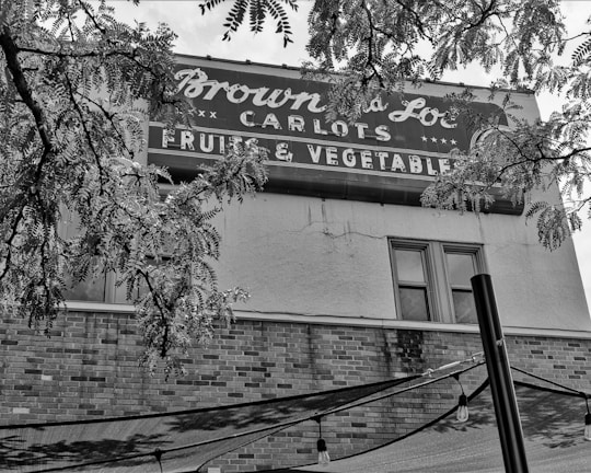 Black-and-white photo of the original family fruit stand from the 1970s.