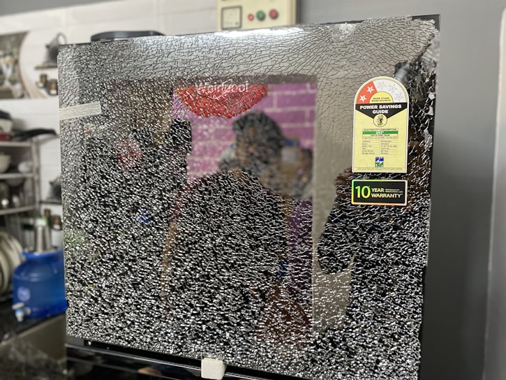 A broken thermopanel glass showcasing the damage.