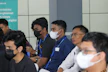 An instructor leading a health and safety training session with attentive participants.