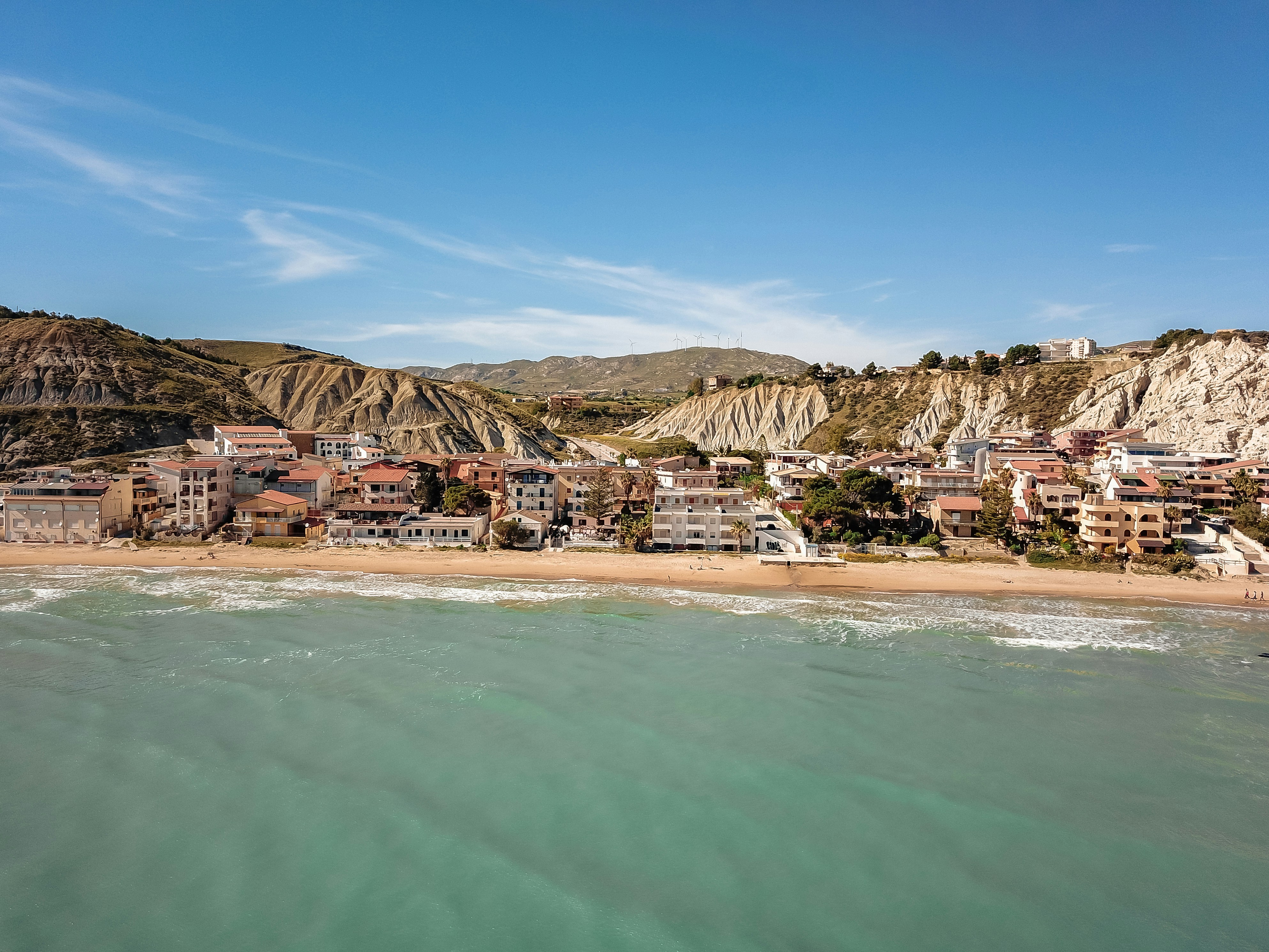 an aerial view of a beach and a city