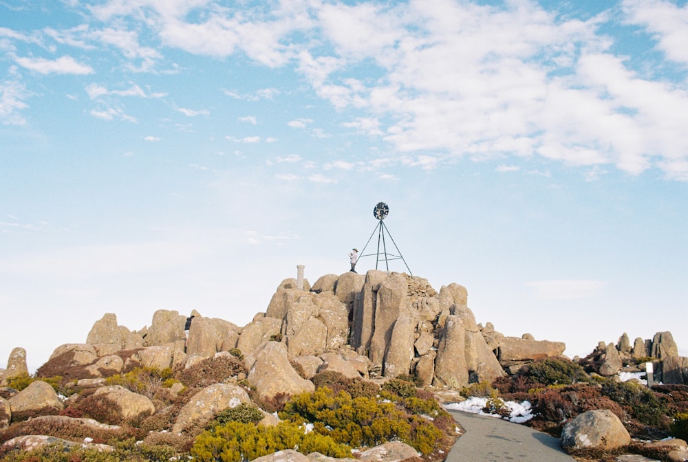 a camera set up on top of a rock formation