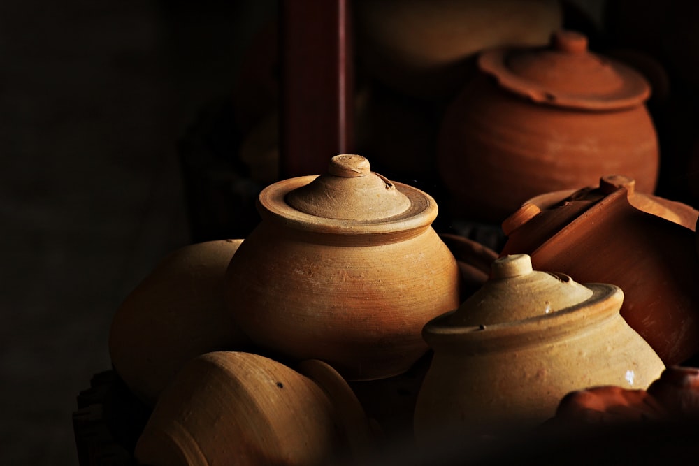 a group of clay pots sitting next to each other