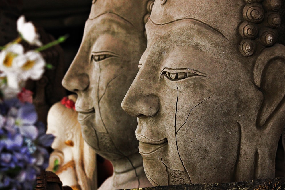 a row of buddha statues sitting next to each other