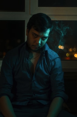 A moody, cinematic portrait of Sahil Chraya in a dark, elegant office space, surrounded by marketing strategy notes and screens.