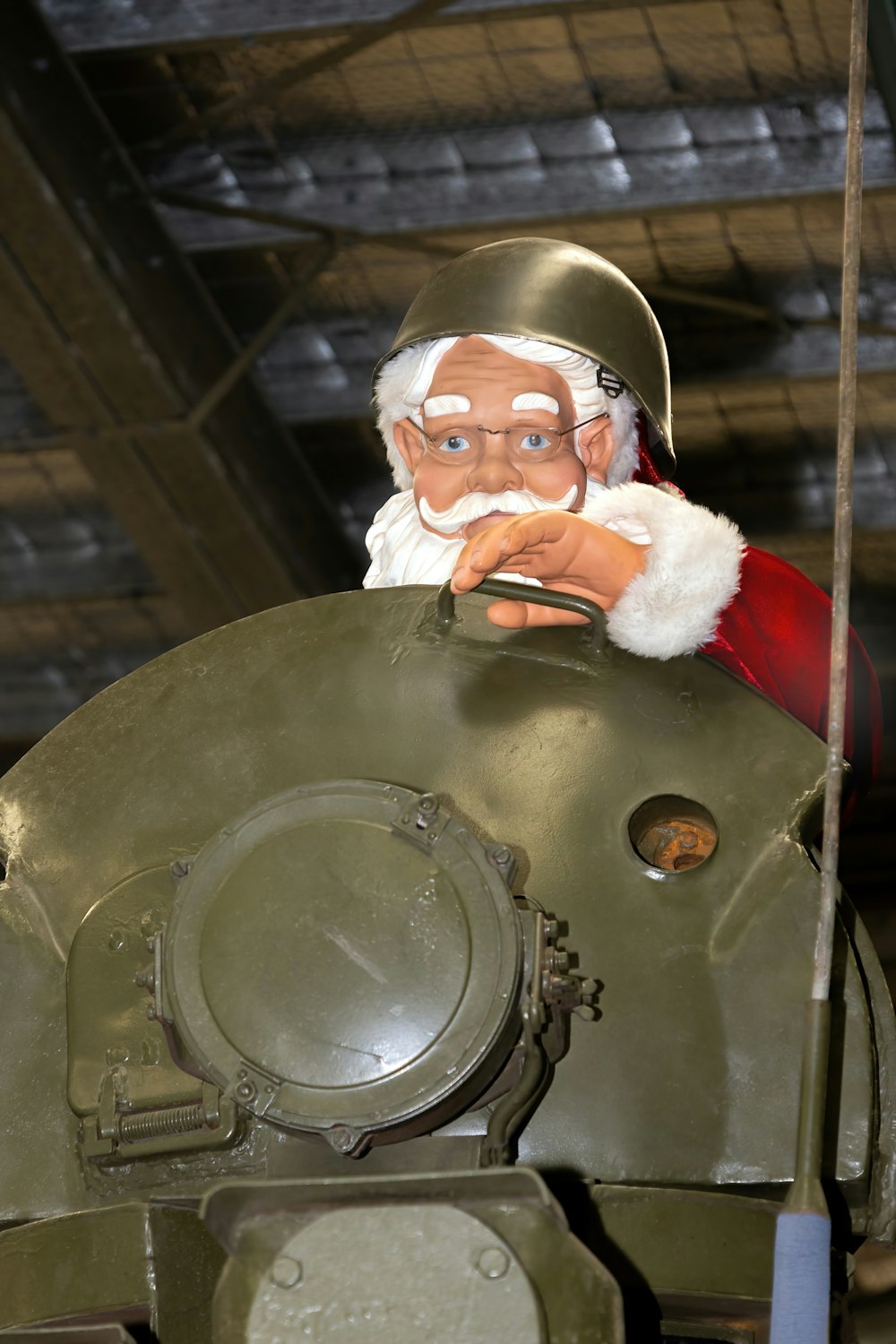 a statue of santa claus is on top of a tank