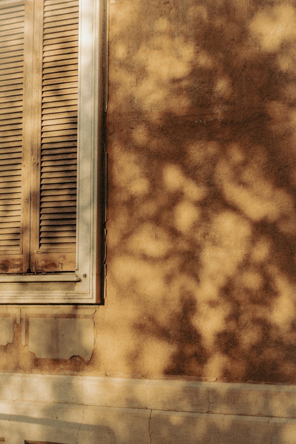 a red fire hydrant sitting in front of a window