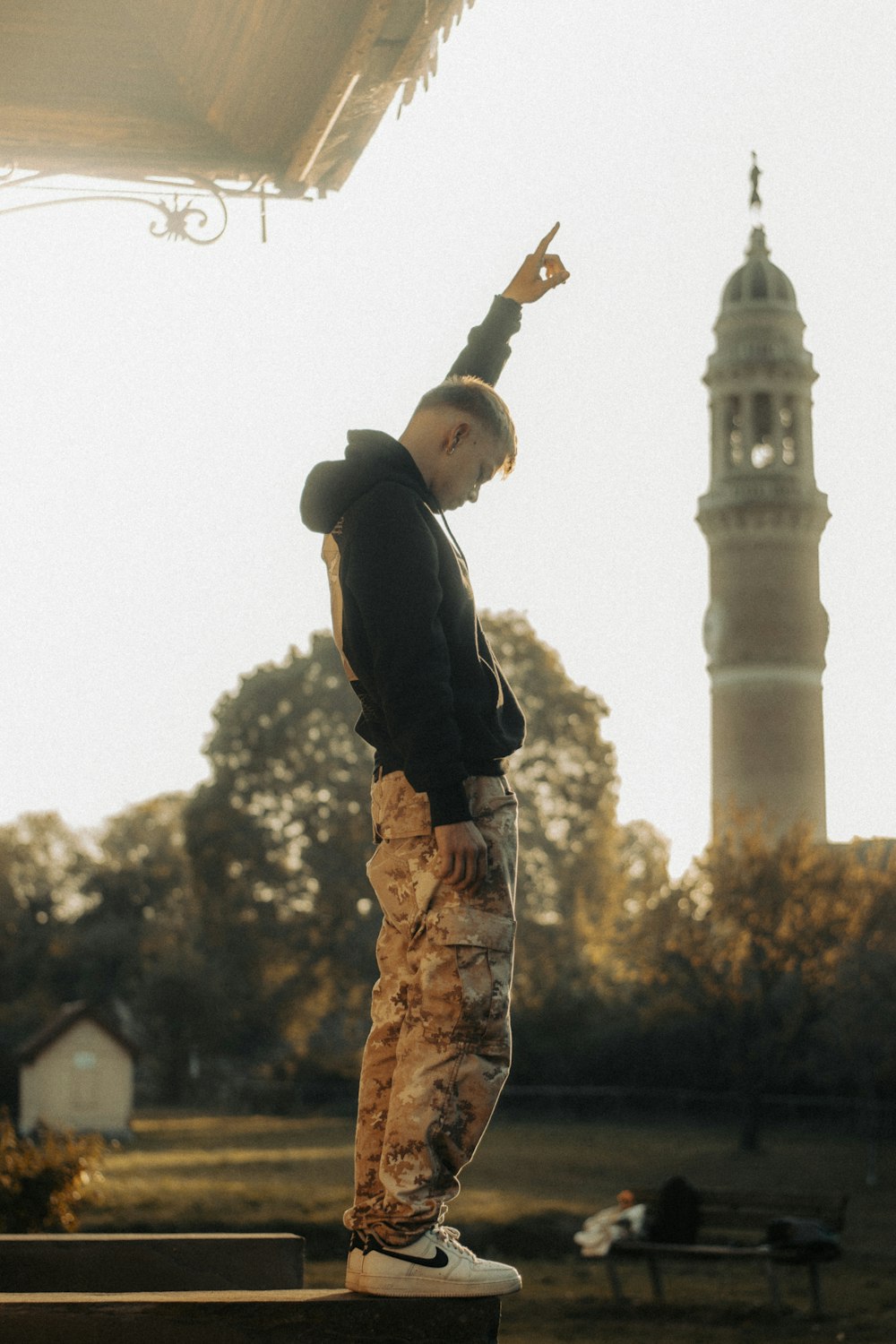 a man riding a skateboard on top of a wooden bench