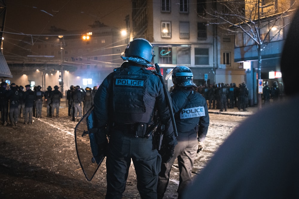 a group of police officers walking down a street