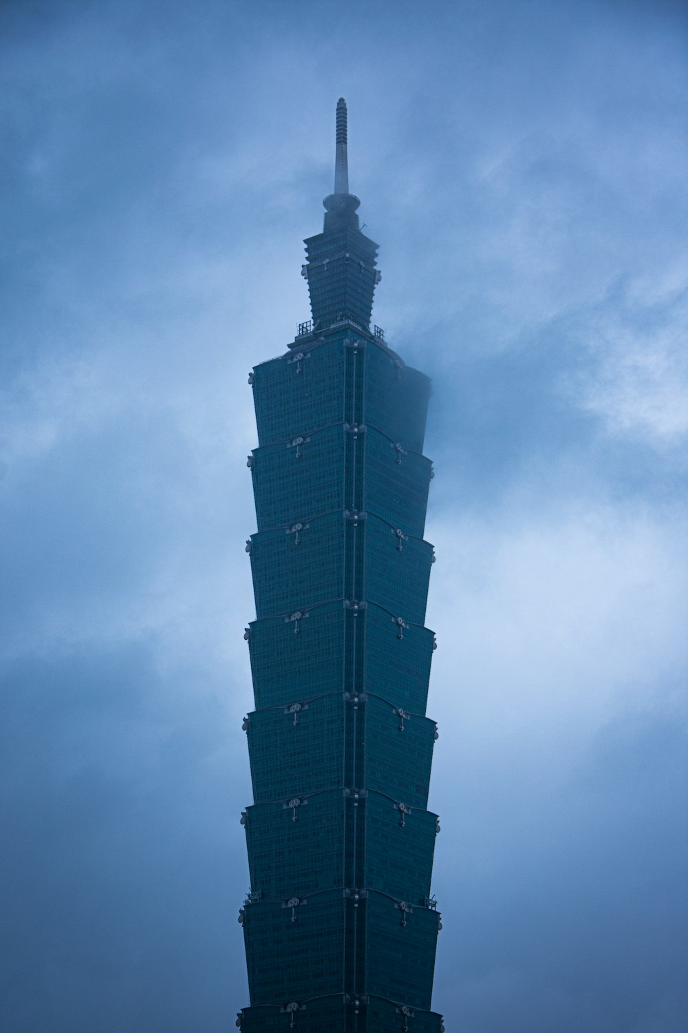 a tall building with a sky background