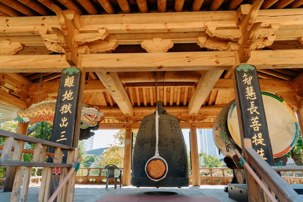 a wooden structure with asian writing on it