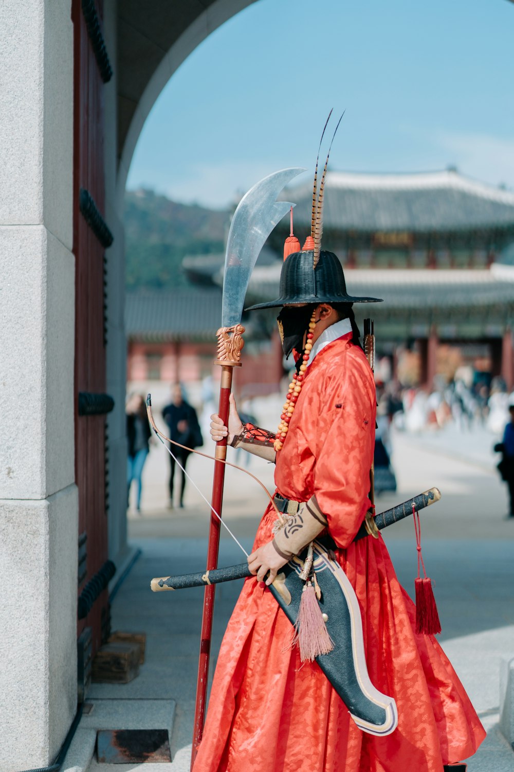 a man dressed in a costume holding a sword