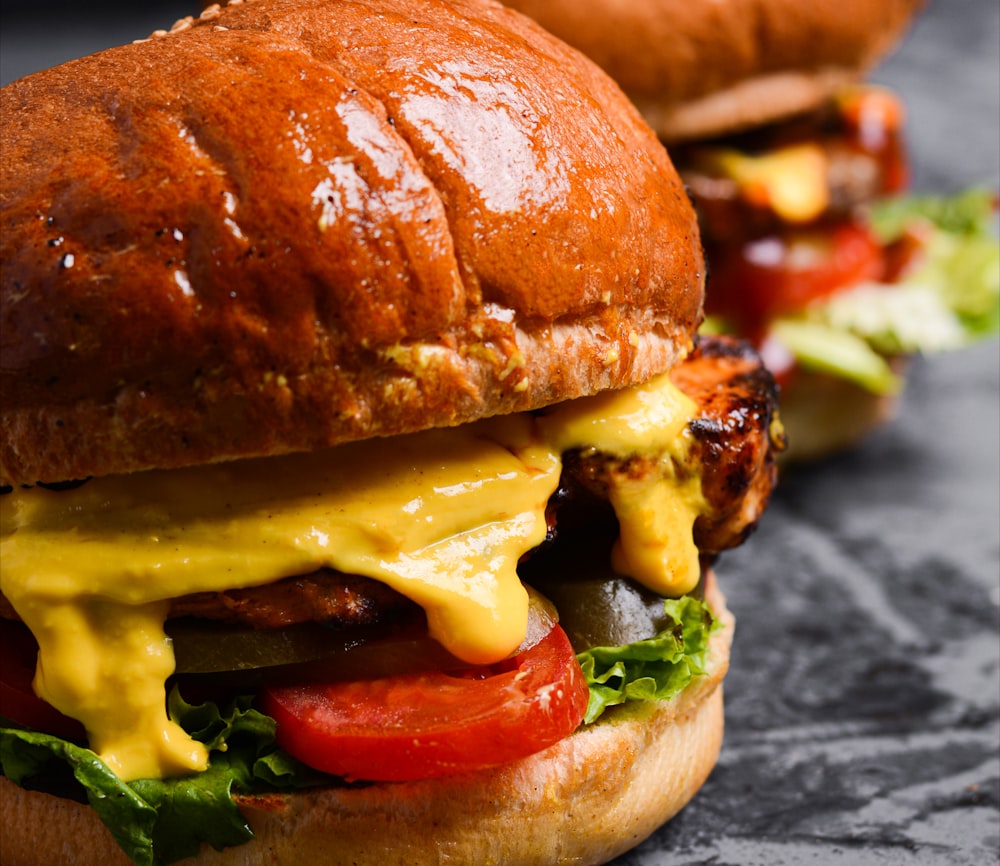 a close up of two sandwiches on a table