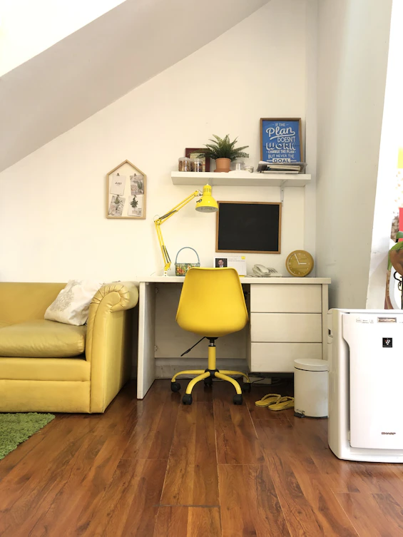 Cozy furnished apartment interior with yellow and black decor elements, ready for workers.