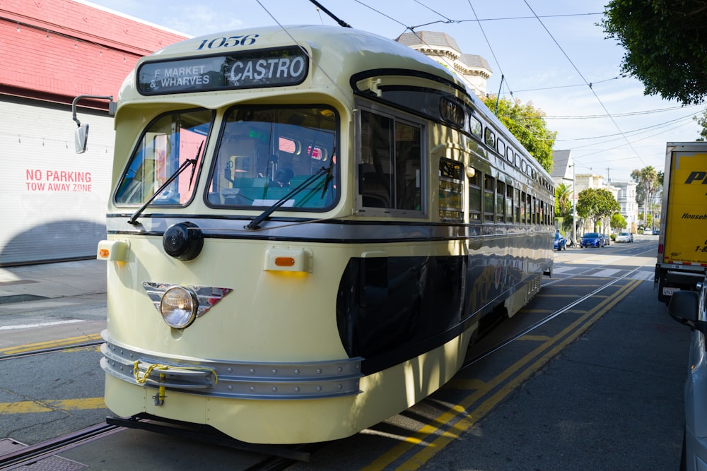 a trolley car is parked on the side of the road