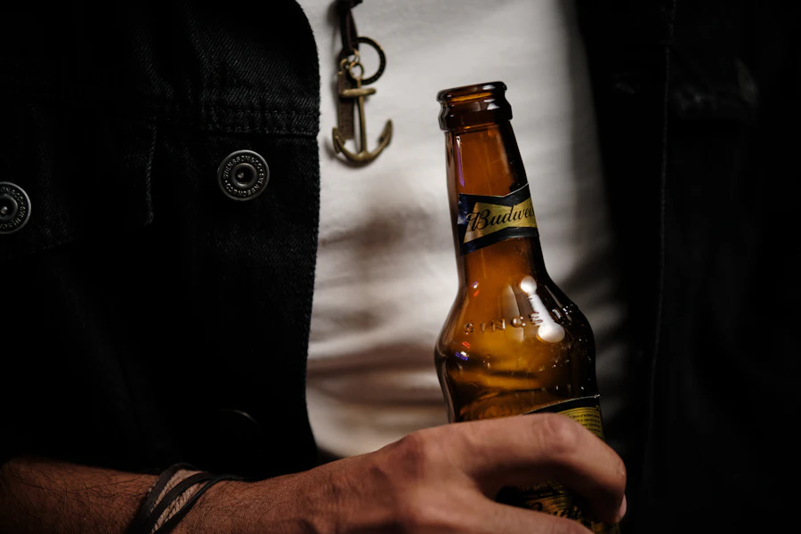 Alcohol bottle held during a moment of reflection
