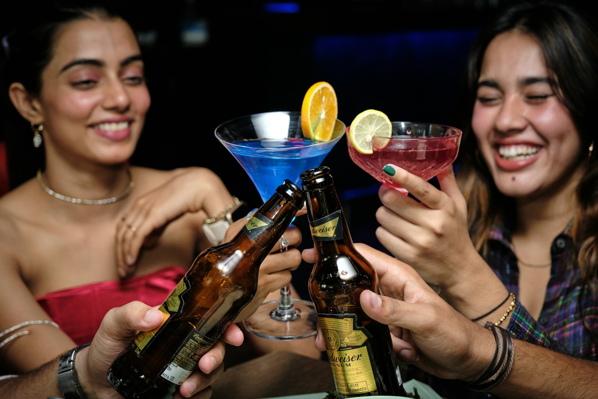 a group of people sitting at a table with drinks