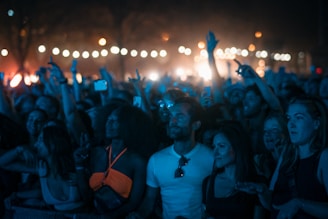 Customers using handy talkies during a large outdoor event.