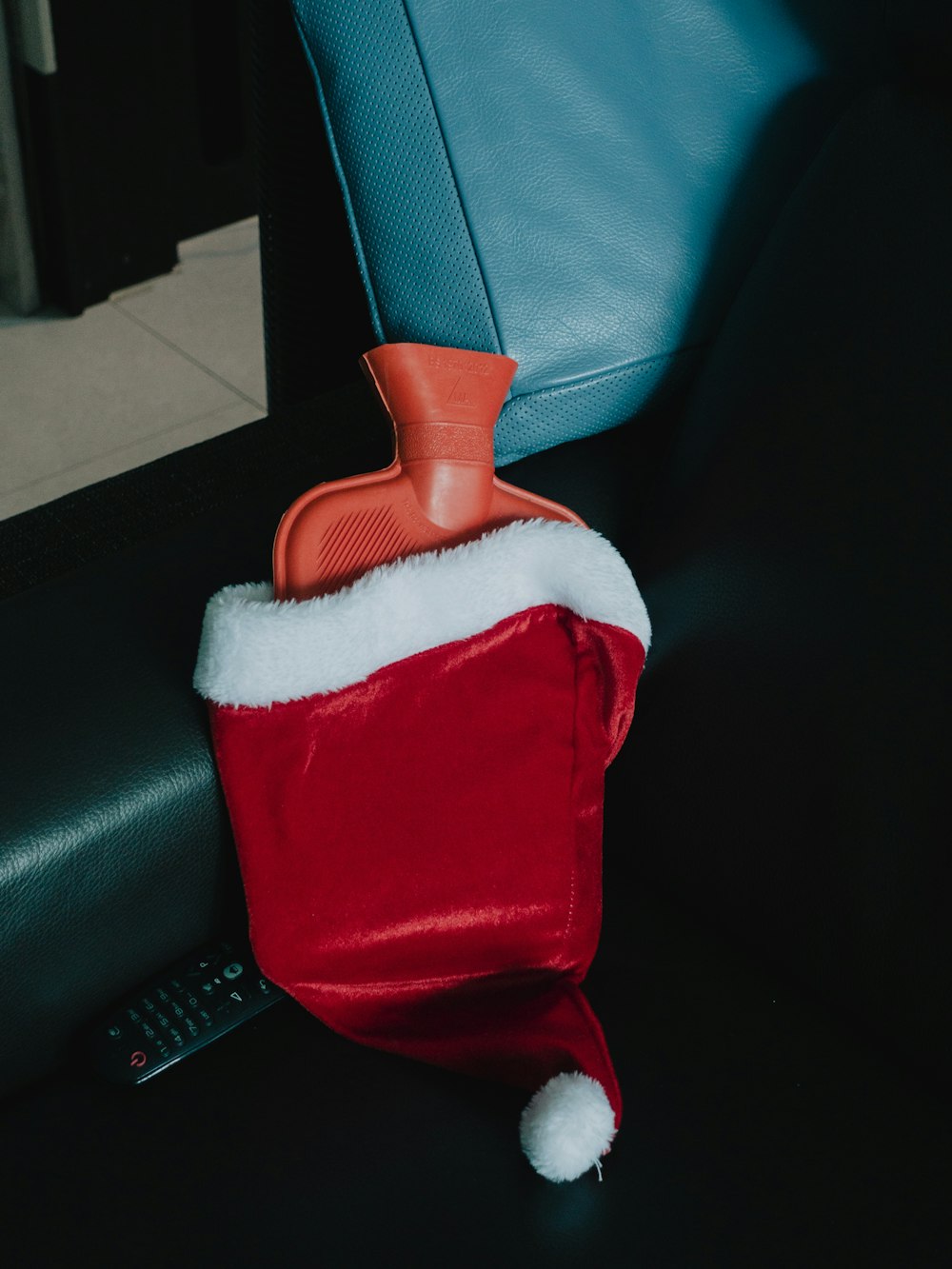 a red and white bag with a santa hat on it