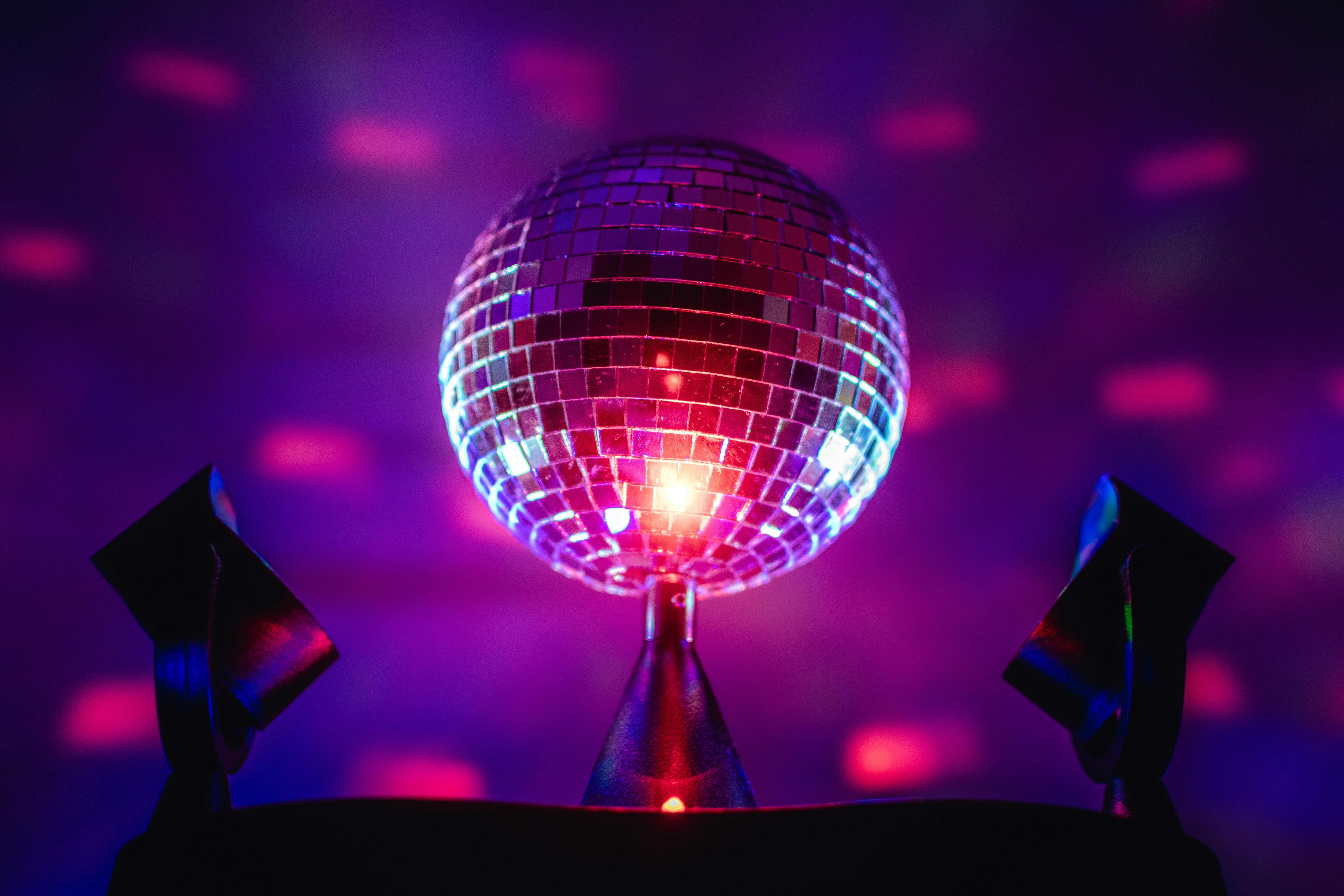 a disco ball sitting on top of a metal pole