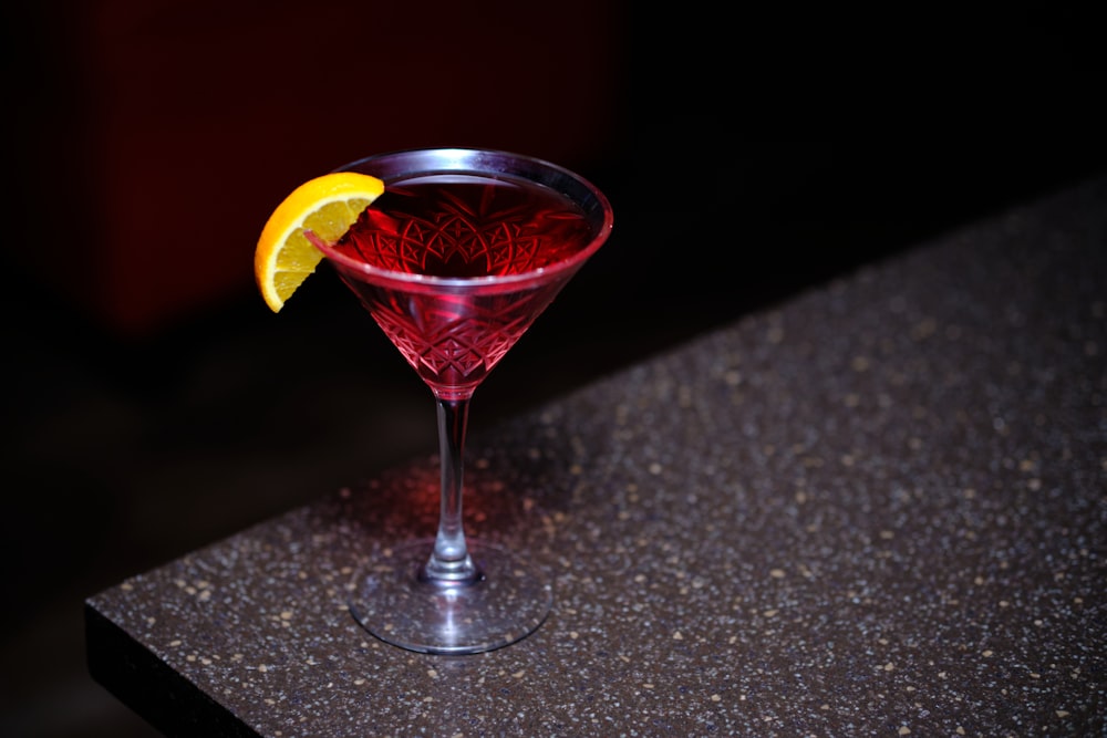 a close up of a wine glass on a table