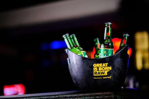 a bucket of beer sitting on top of a table