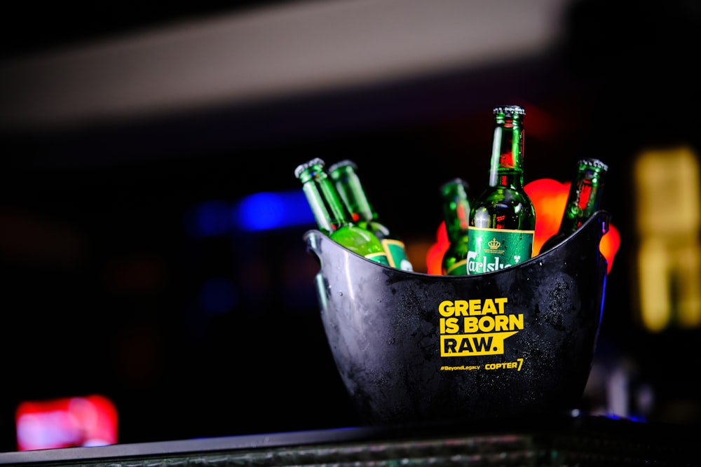 a bucket of beer sitting on top of a table