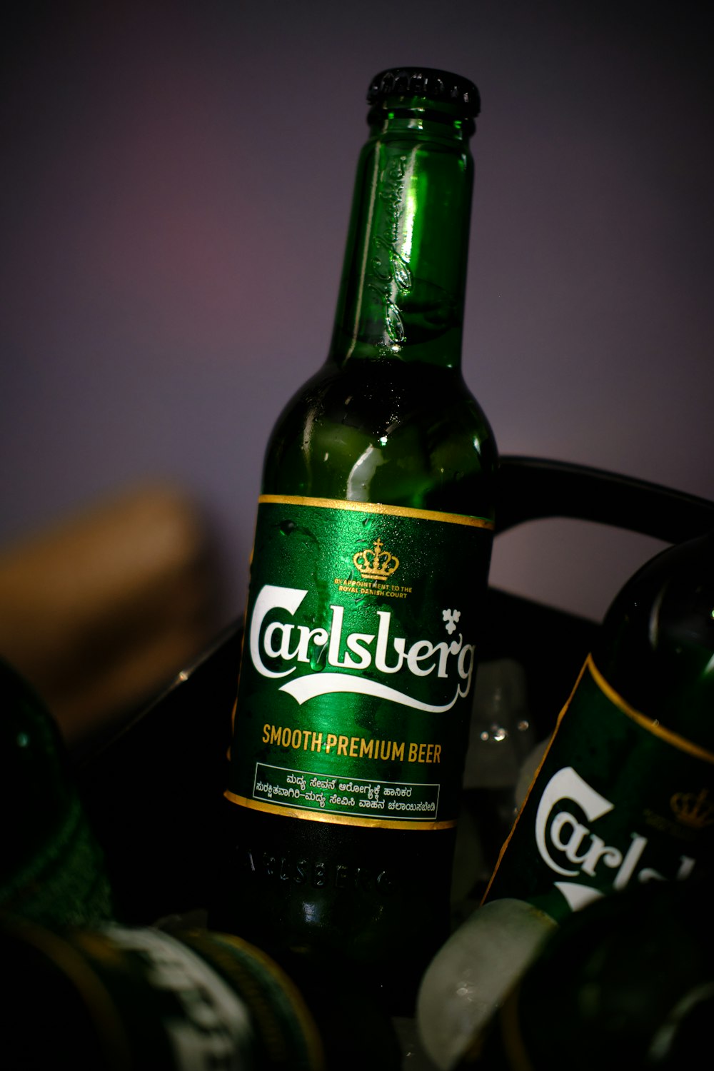 a close up of a bottle of beer on a table