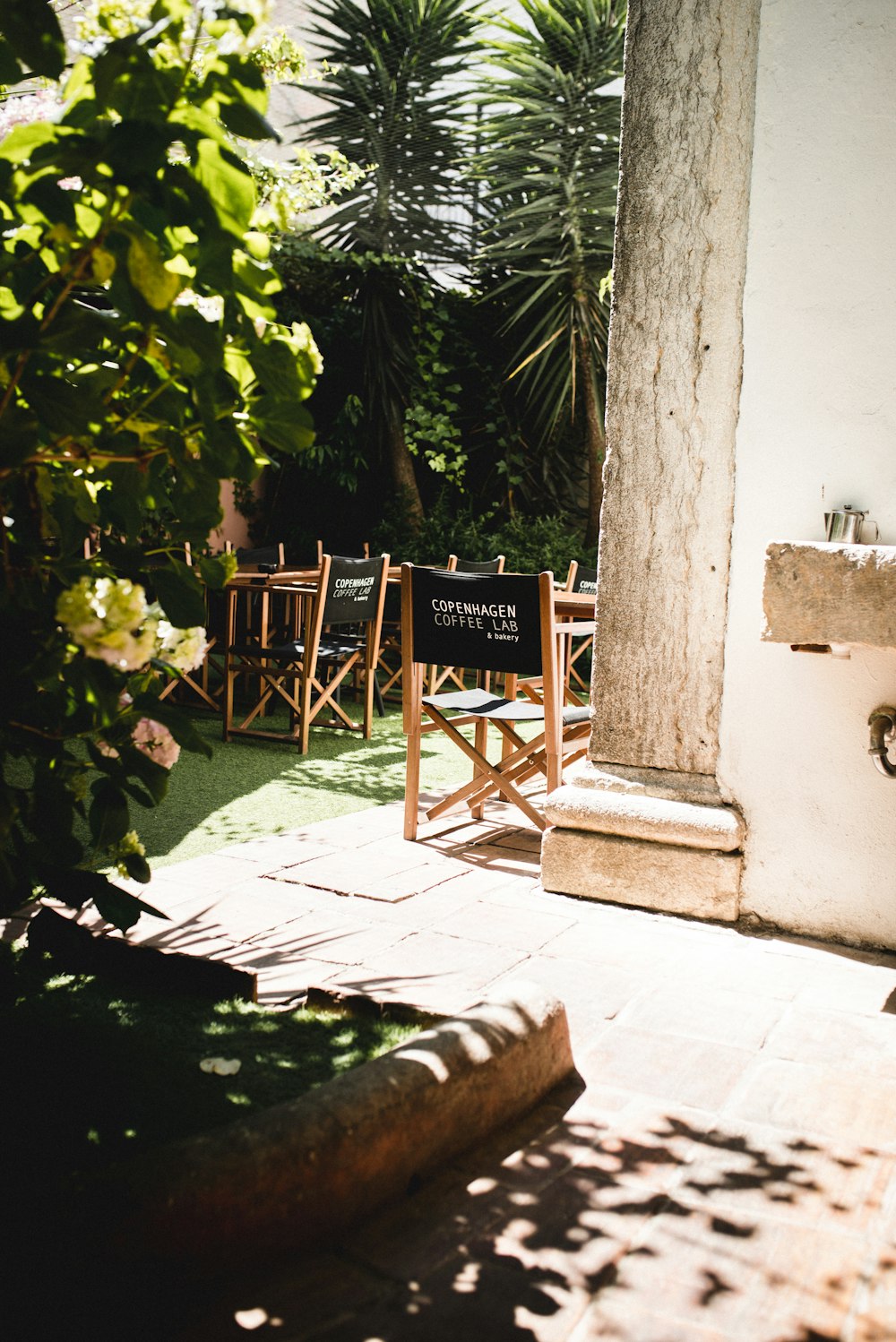 a table and chairs sitting outside of a building