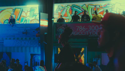 Album cover art featuring moody urban nightscape with bold typography.