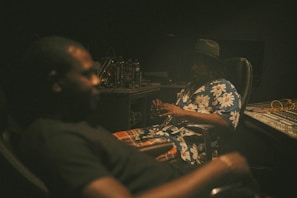 Willy Bula collaborating with Koffi Olomide in a recording studio