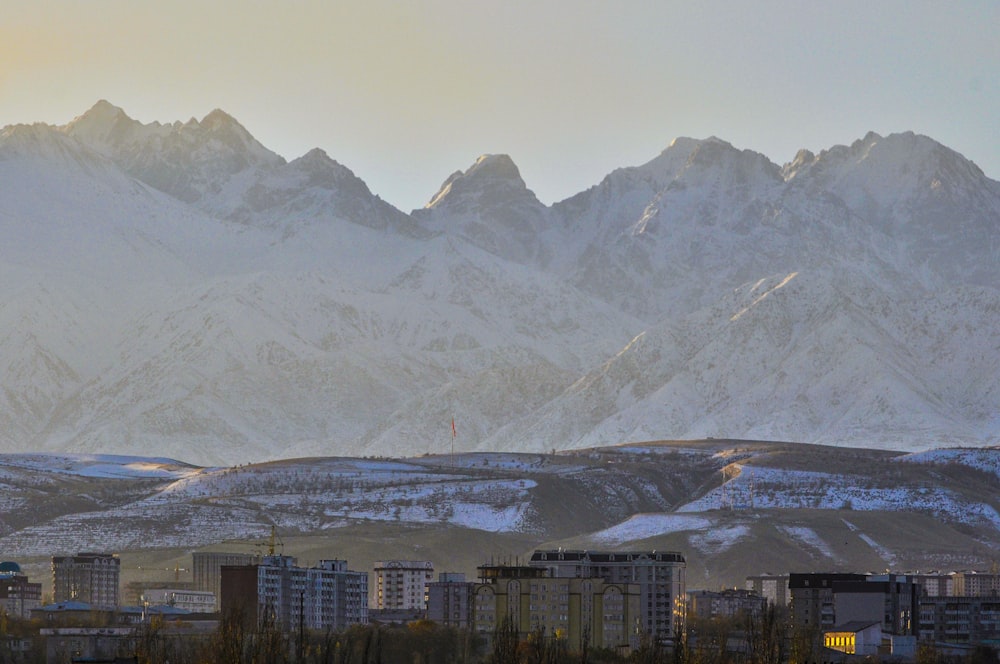 a view of a city with mountains in the background