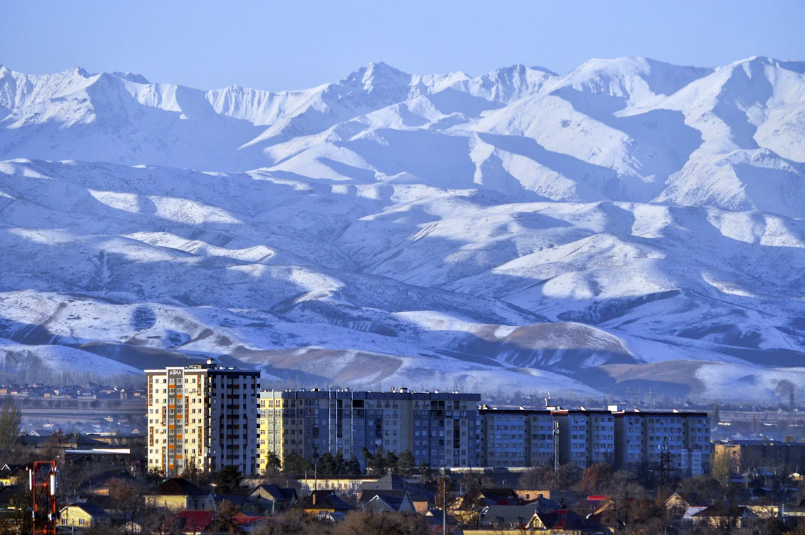 Jagged alpine peaks under a blue sky