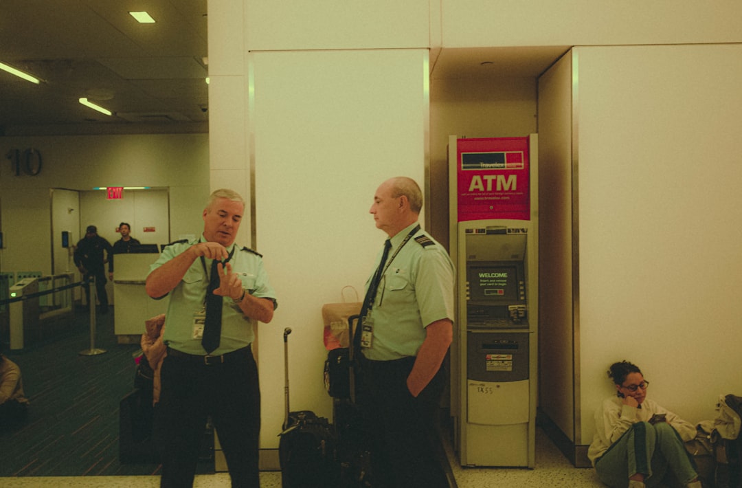 a couple of men standing next to each other,