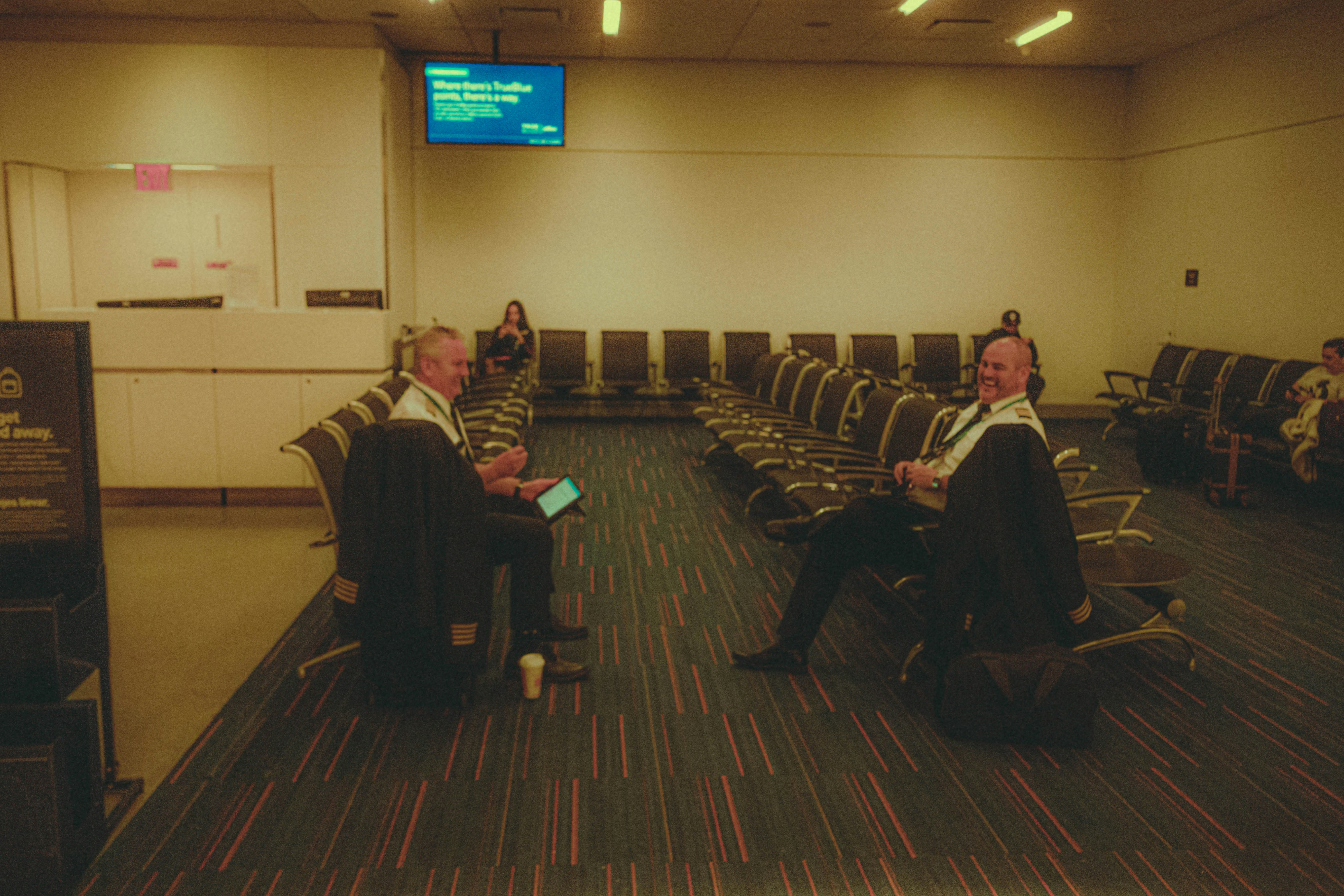 a group of people sitting in chairs in a room