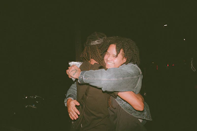 Two people embracing warmly, illustrating healed and strengthened relationships.