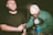 A close-up of a satisfied customer shaking hands with a craftsman in a workshop.