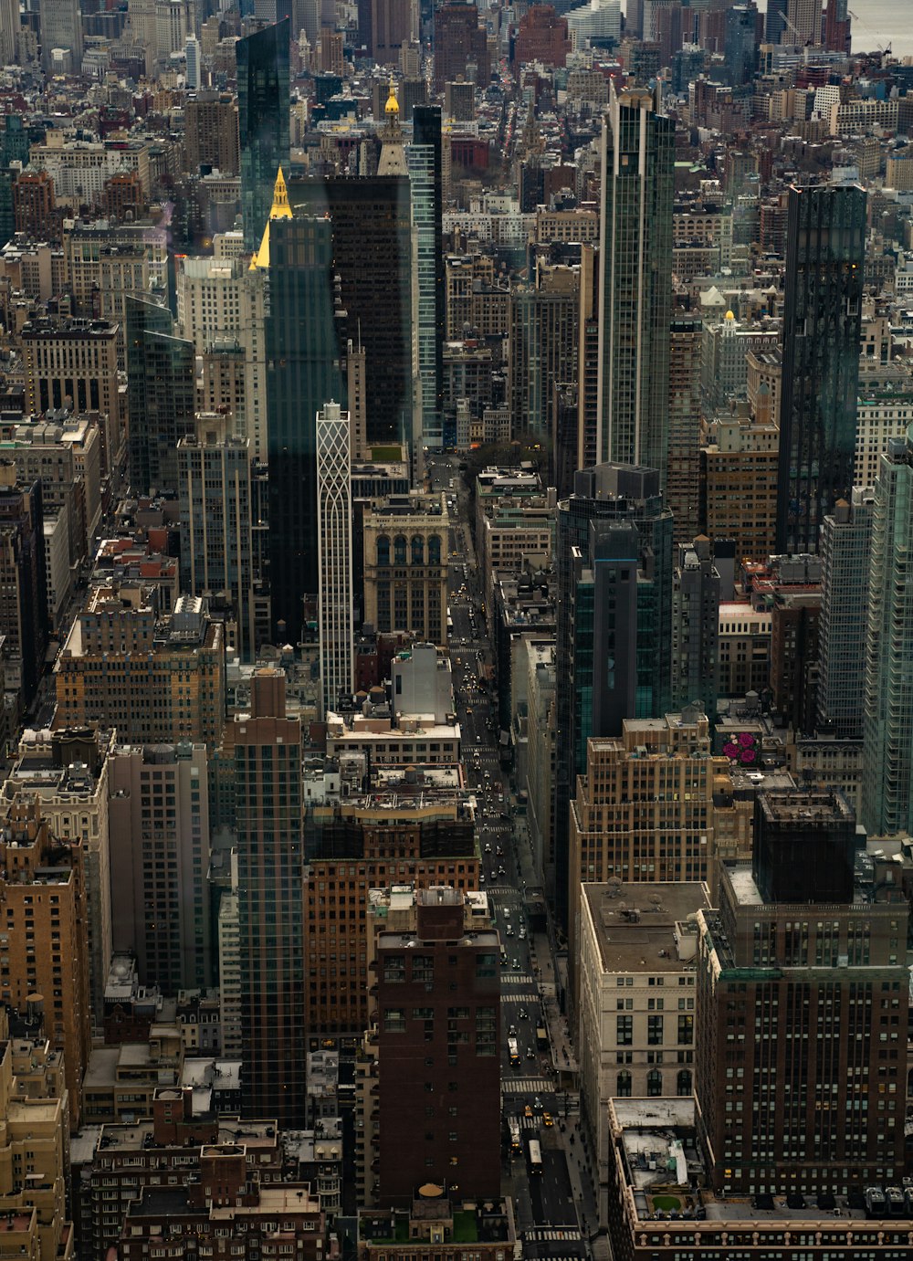 an aerial view of a city with tall buildings