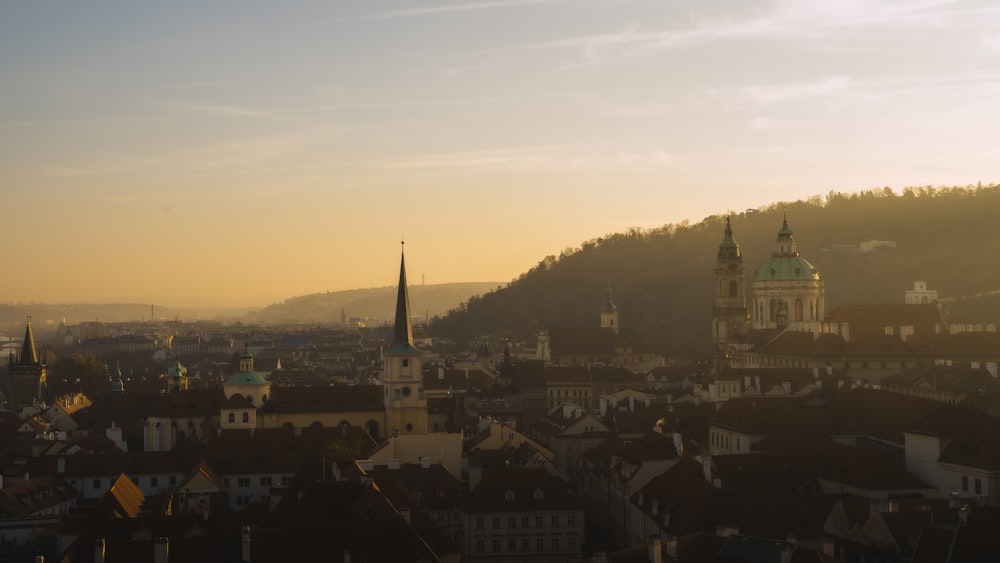 a view of a city with a steeple in the background