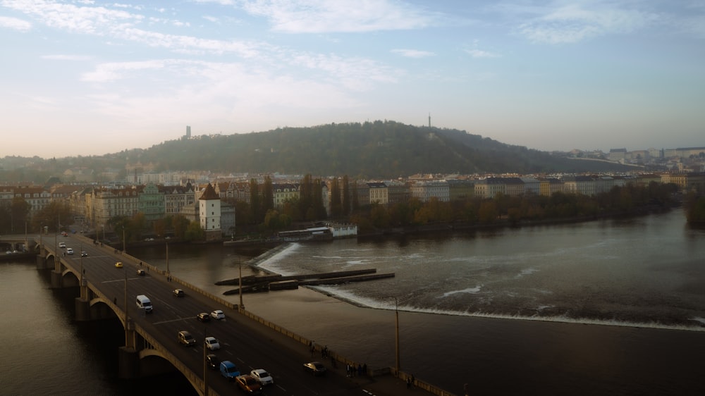 a bridge over a river with cars driving on it