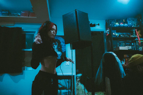 An intimate recording session with a singer-songwriter layering English and French vocals