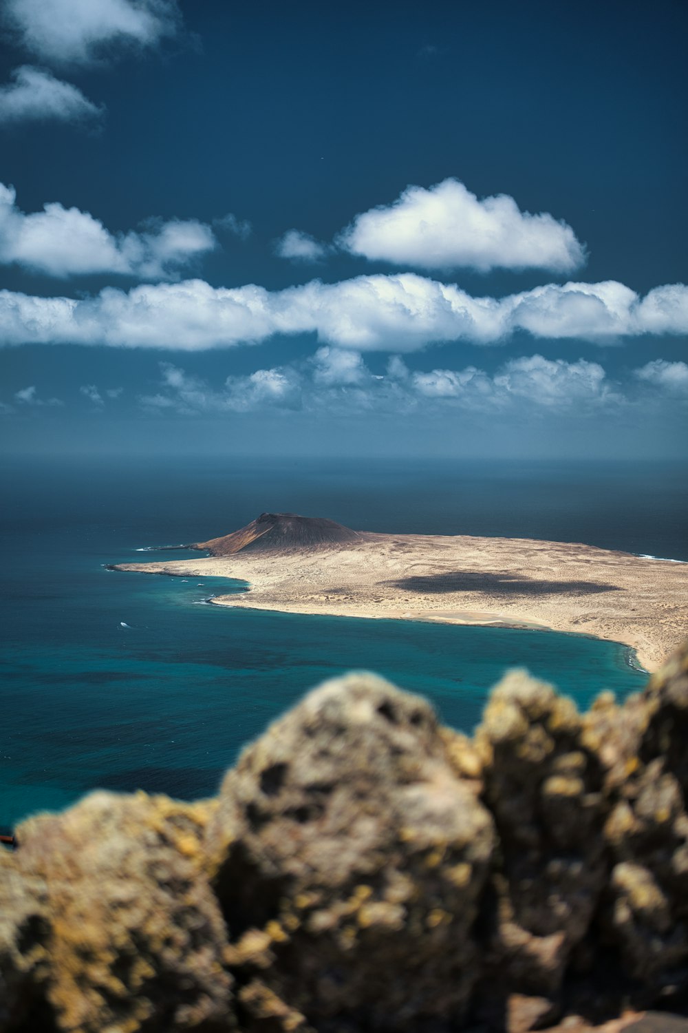 a view of the ocean from the top of a hill