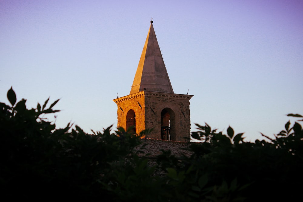 a tall tower with a clock on top of it