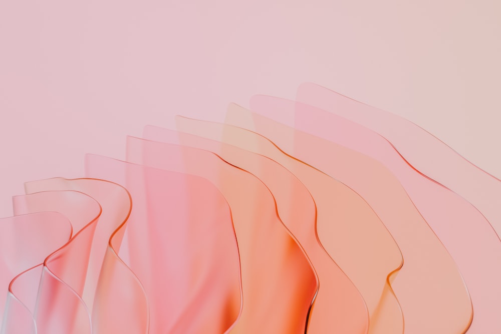 a pink and orange background with wavy lines