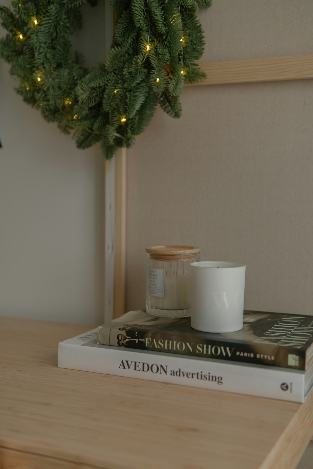 a stack of books sitting on top of a wooden table