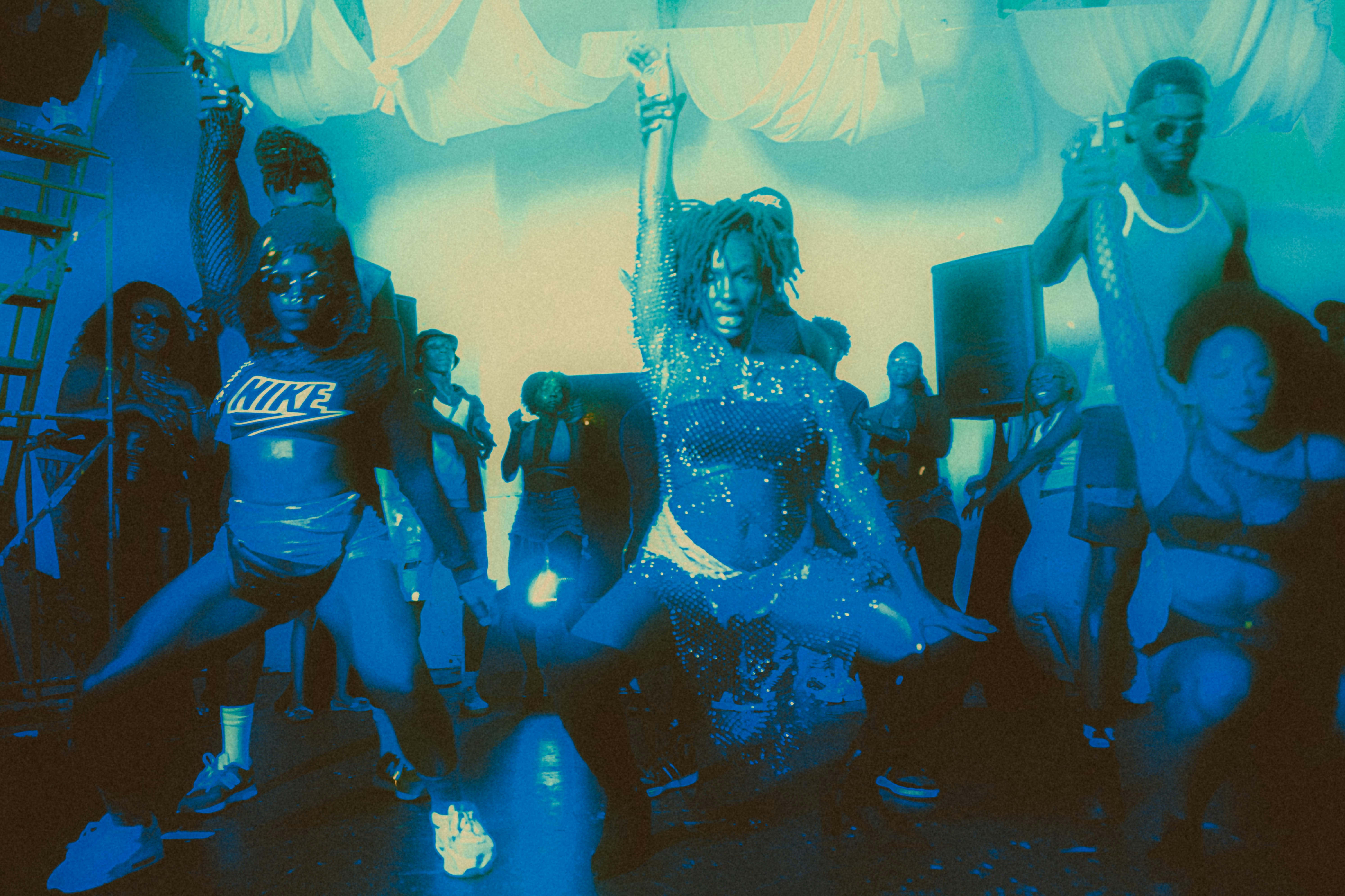 a group of people standing around each other