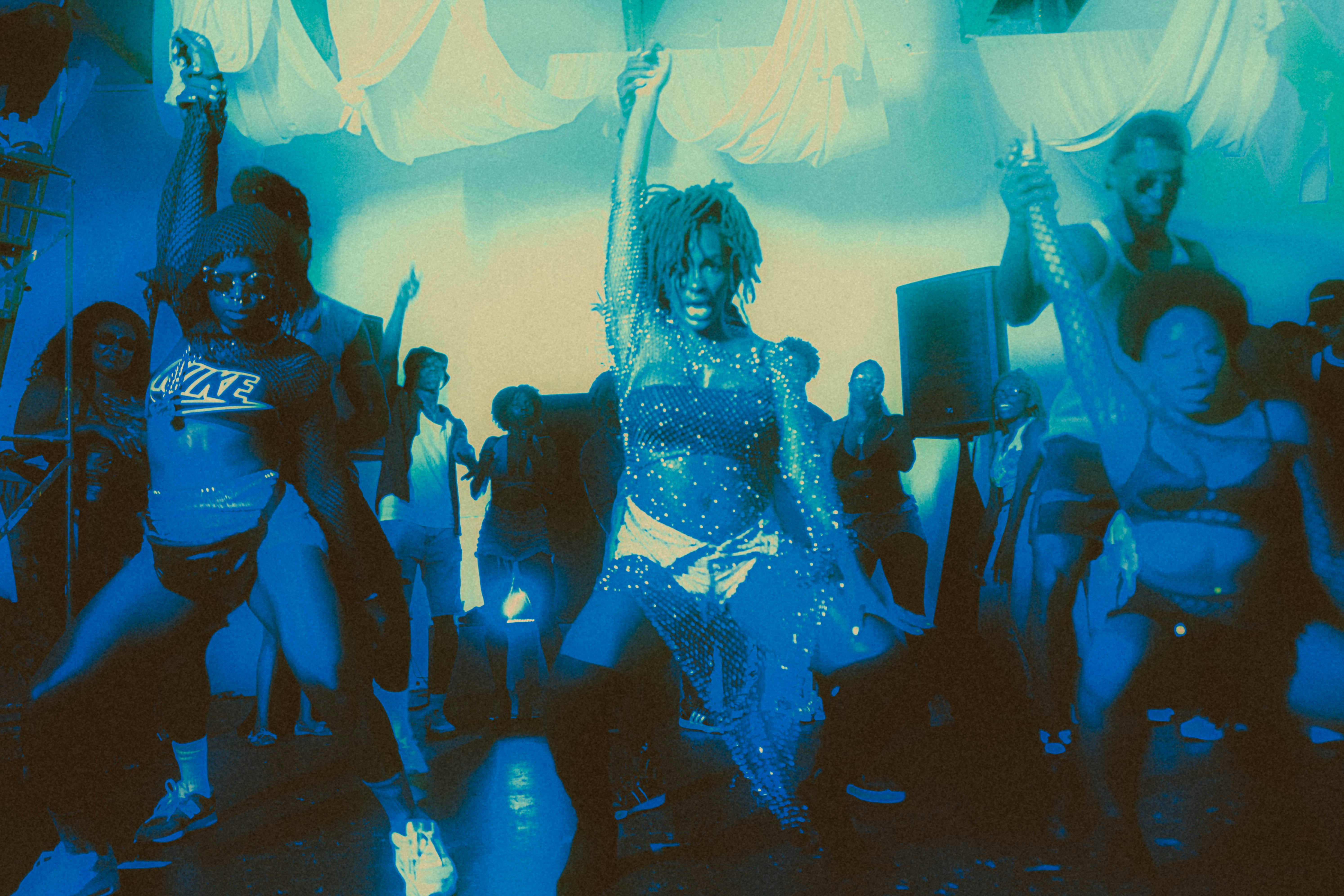 a group of people dancing in a room