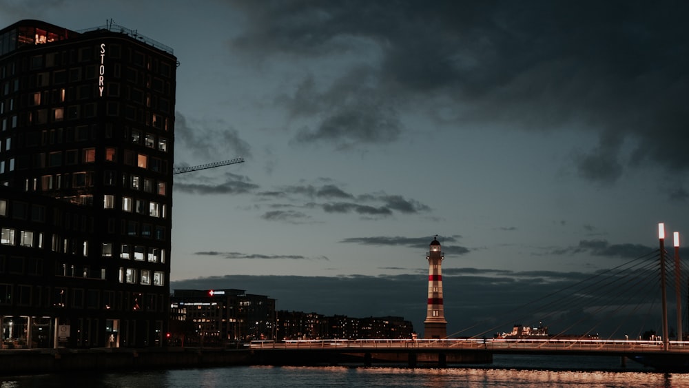 a tall building sitting next to a body of water