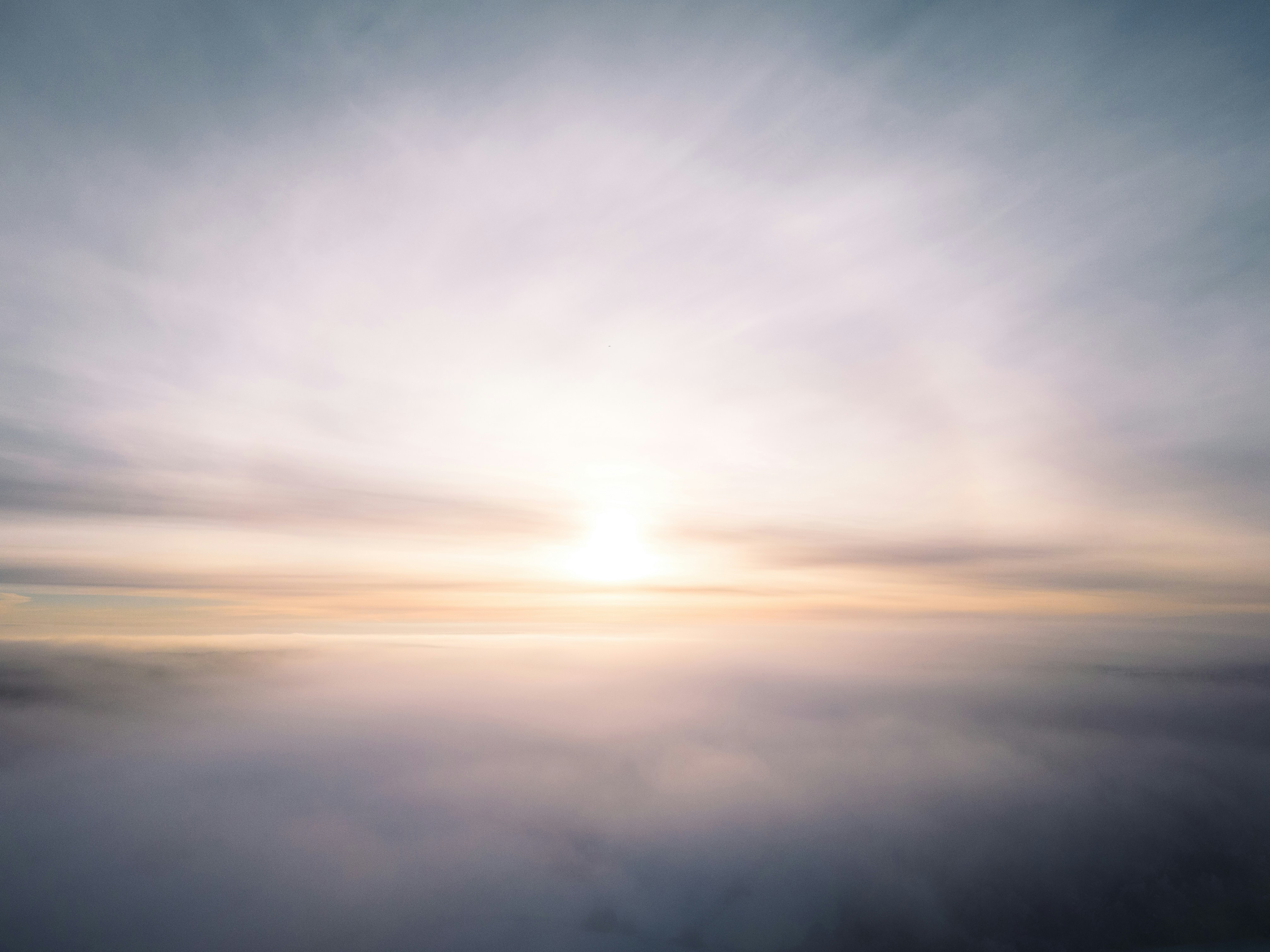 the sun is shining through the clouds in the sky