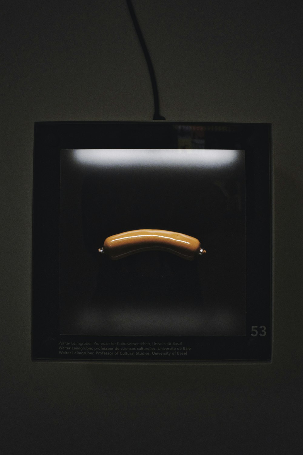 a picture of a banana in a black frame